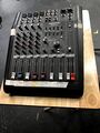 Mackie DFX 6. All analog XLR or quarter inch in or out. Connects to the main mixer so there is no amp. Does require its own power via Zip cord. Can provide optional phantom power to all mic channels. Typically used with the Show Cue Systems laptop using an external sound card which allows the SCS project to send multiple channels for easier mixing.