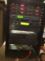 The rack mount cabinet holds individual processors that can apply effects such as reverb. It also holds compressors, companders, and anti-feedback devices. It used to be a staple at shows, but newer boards have much of this functionality built in and so it isn't used a all anymore. We keep it around just in case.